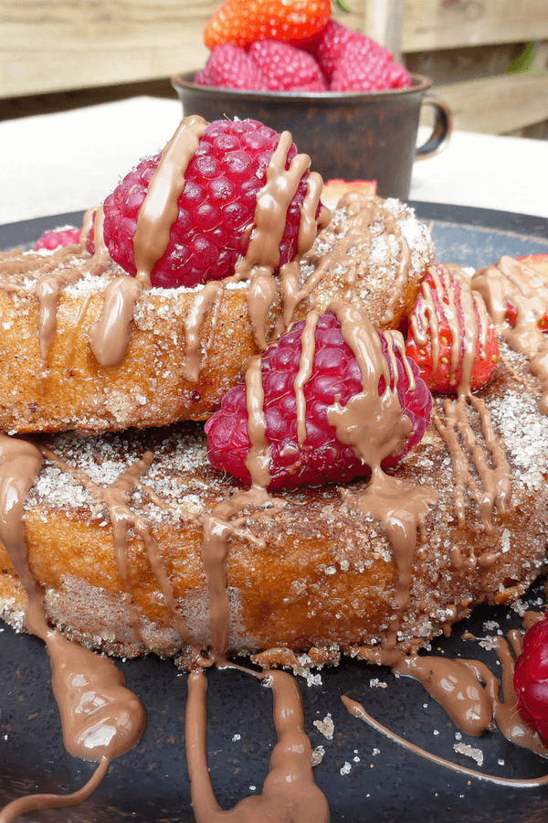 Churros French Toast (with milk chocolate, strawberries & raspberries)