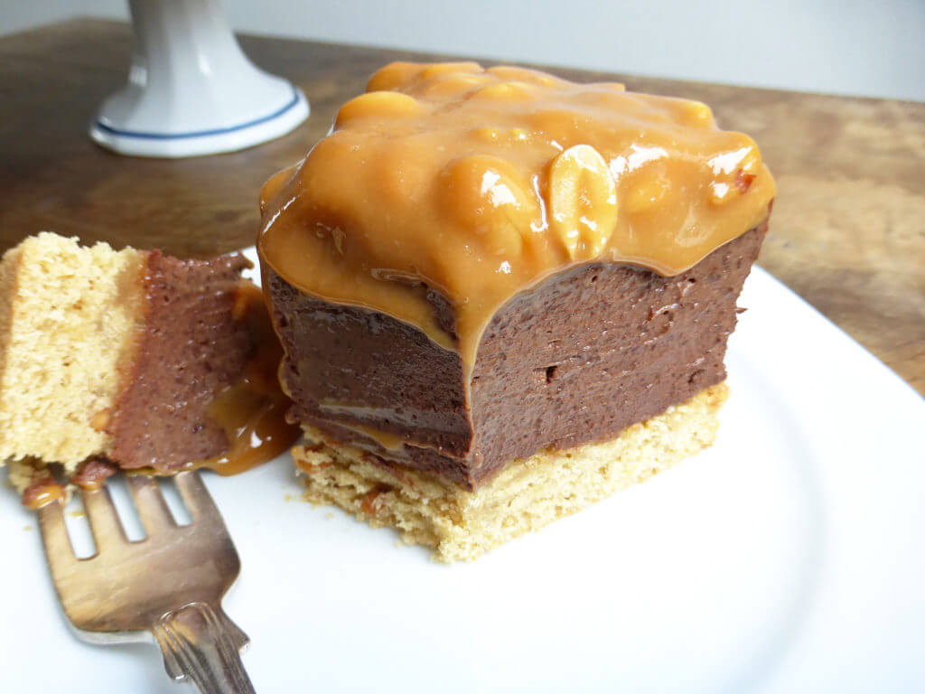 Chocolate Cheesecake with a Peanut Butter Cake Crust and Salted Peanut Dulce de Leche Topping